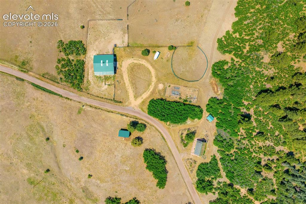 Image 48 of 50: Aerial view of stable photographed June 2026