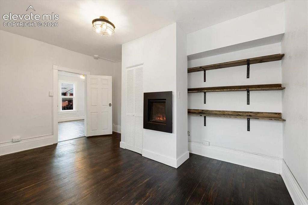 Image 12 of 39: Cottage 2 - refinished floors in living room