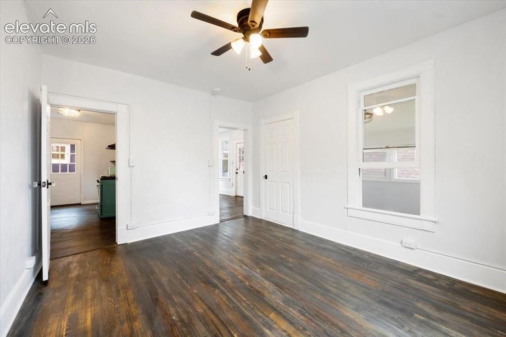 Image 13 of 39: Cottage 2 - bedroom, refreshed wood floors
