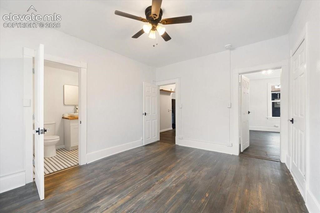 Image 14 of 39: Cottage 2 - bedroom, refreshed wood floors