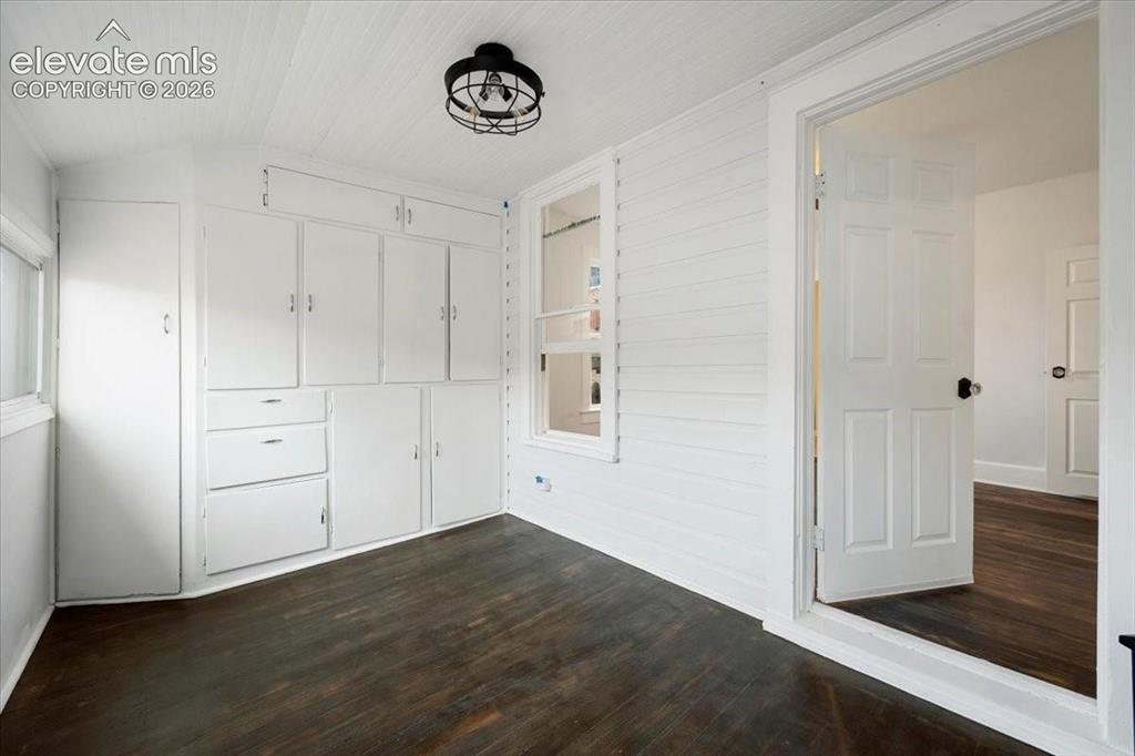 Image 16 of 39: Cottage 2 - office with built-in cabinets and drawers