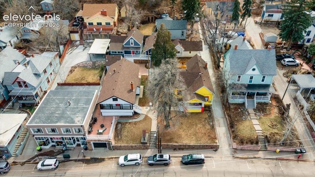 Image 33 of 39: The 4 Crosby Cottages are nestled behind 125 Ruxton and 129 Ruxton, both of