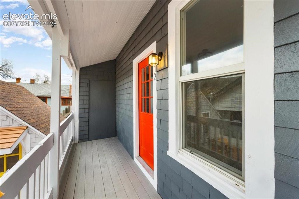 Image 8 of 39: Cottage 2 - welcoming front porch