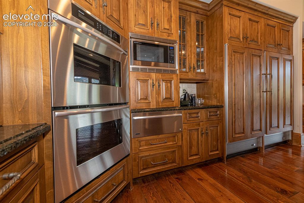 Image 12 of 50: Dual Thermador ovens, microwave and warming drawer.