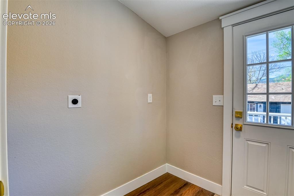 Image 22 of 47: Utility wall featuring a dedicated dryer vent and electrical outlet