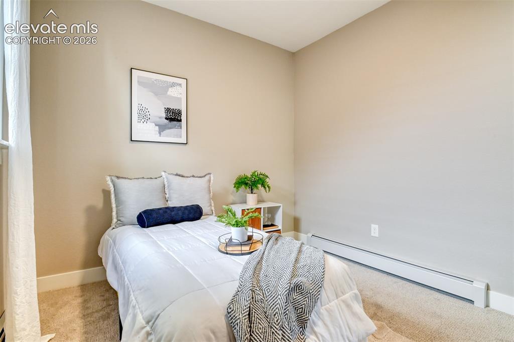 Image 30 of 47: Carpeted room featuring a white baseboard and light-toned walls