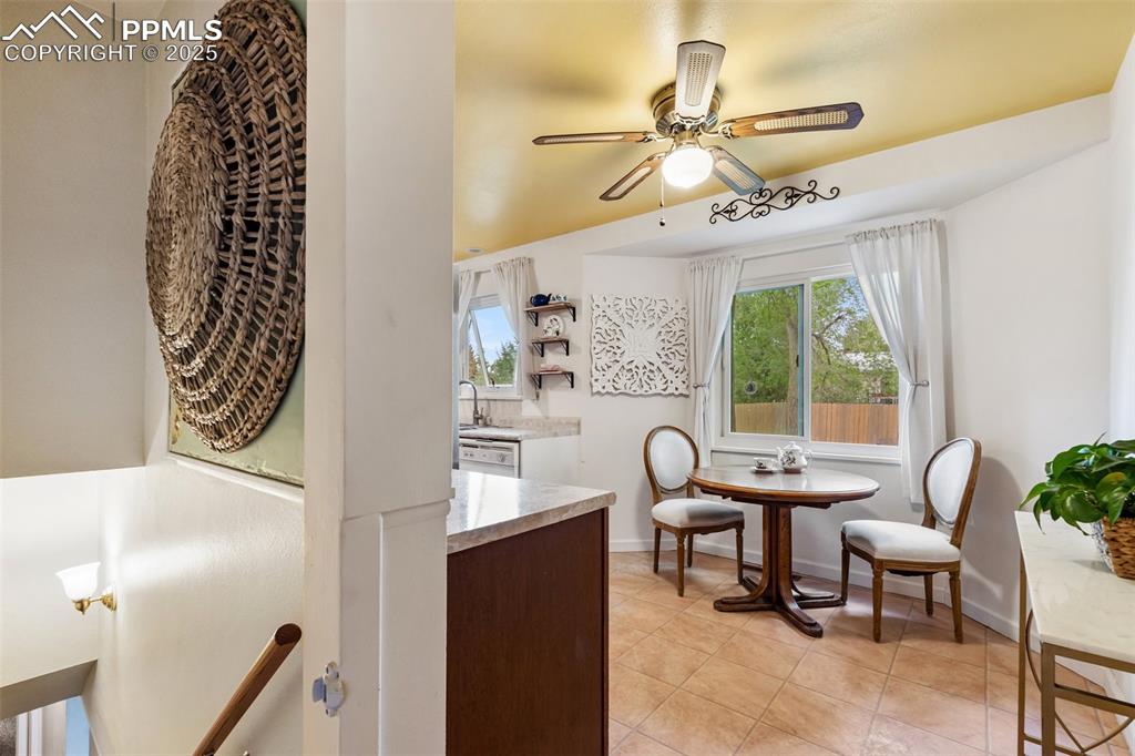 Image 15 of 45: Dining area overlooks private yard