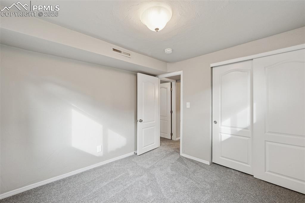 Image 27 of 34: Unfurnished bedroom featuring carpet floors and a closet