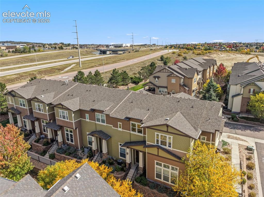 Image 3 of 44: Aerial view showcasing a contemporary townhome community with distinctive e