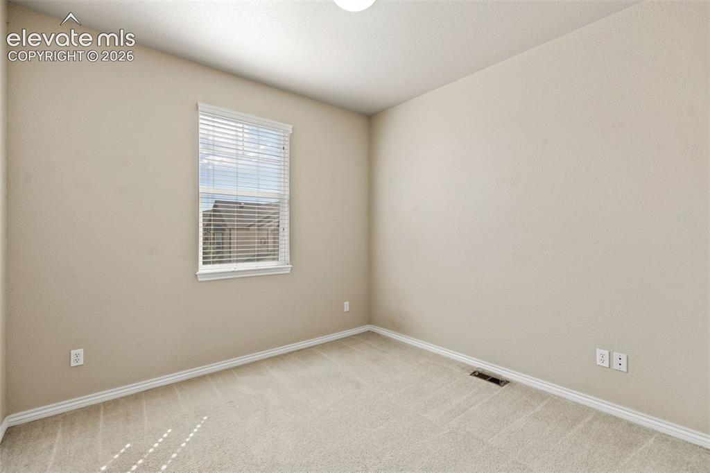 Image 41 of 44: Bright and airy bedroom featuring neutral wall finishes, recessed ceiling l