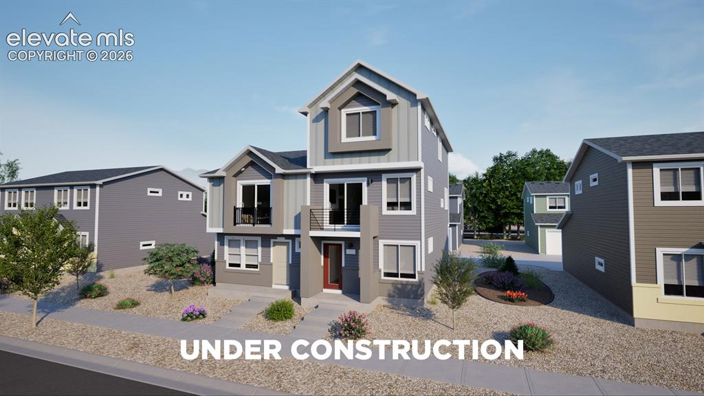 Caption: Multi-level exterior with varied siding textures, private balcony, and an accented entry door