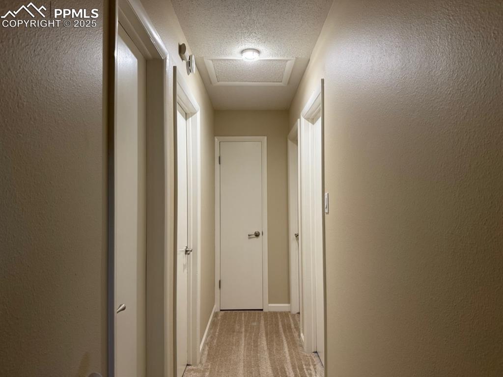 Image 12 of 32: Upstairs hallway to bedrooms