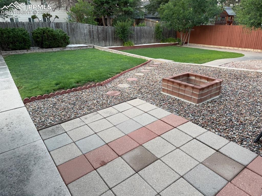 Image 31 of 32: Firepit with new pavers
