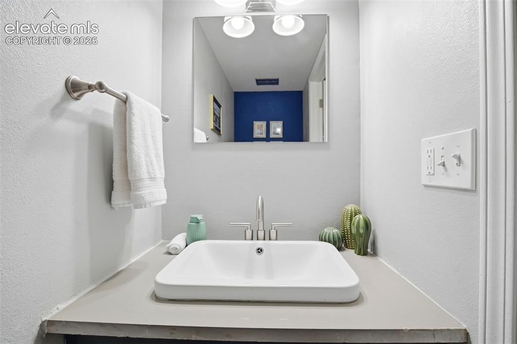 Image 10 of 49: Half bath on main floor