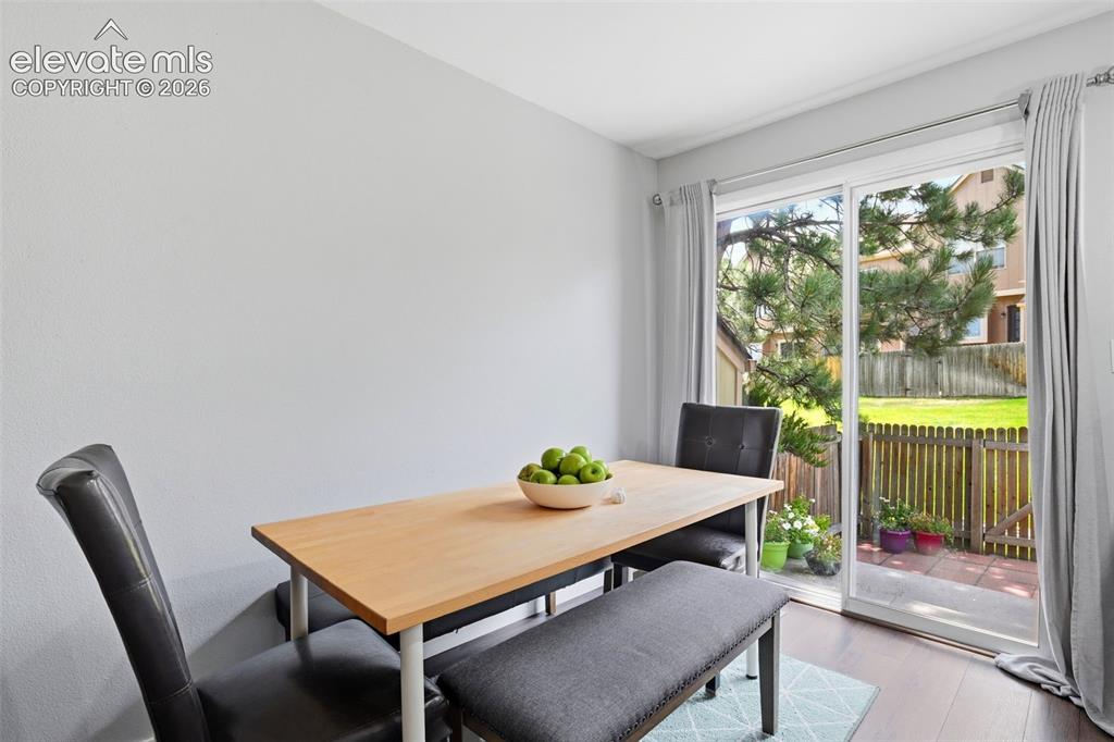 Image 11 of 49: The dining area leads to the private back patio.
