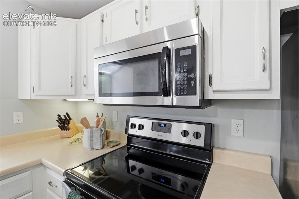 Image 14 of 49: Stainless steel appliances throughout the efficient kitchen