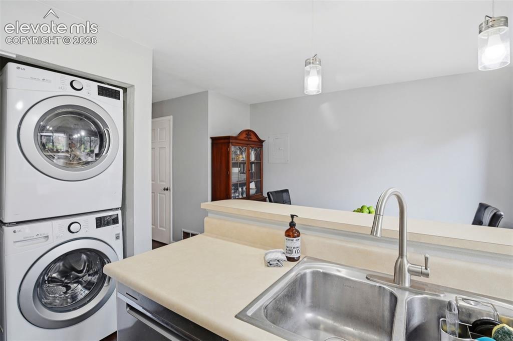 Image 16 of 49: Stackable washer and dryer set is included with the townhome.