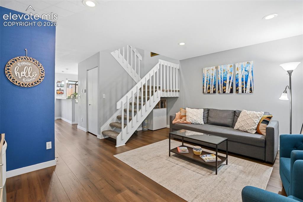 Image 5 of 49: Enter into the welcoming living room with abundant natural light.