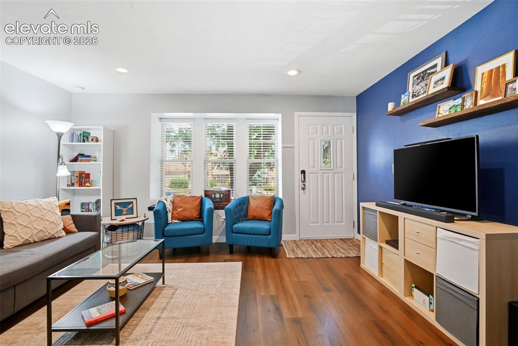 Image 9 of 49: Living room and front entry way