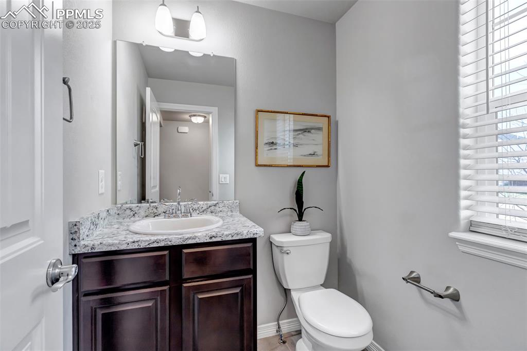 Image 11 of 35: Main floor half bath 