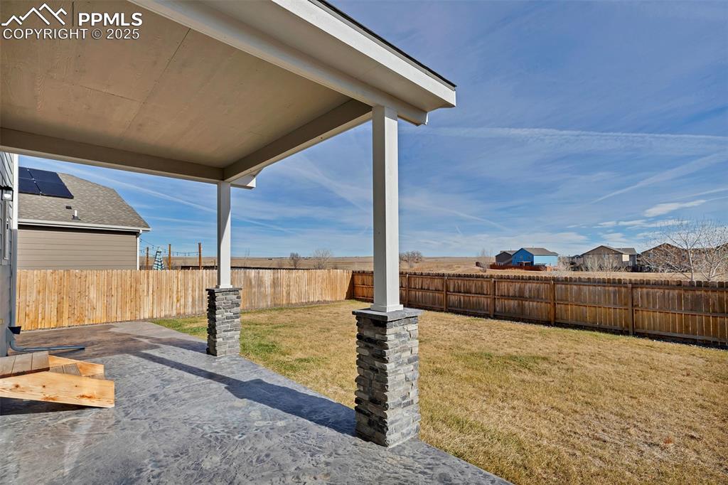 Image 31 of 35: Large stamped concrete patio