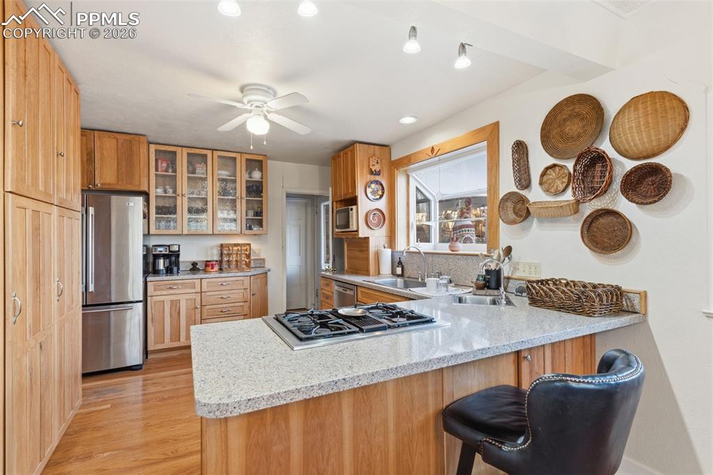 Image 15 of 50: Hardwood flooring continues into the Kitchen!