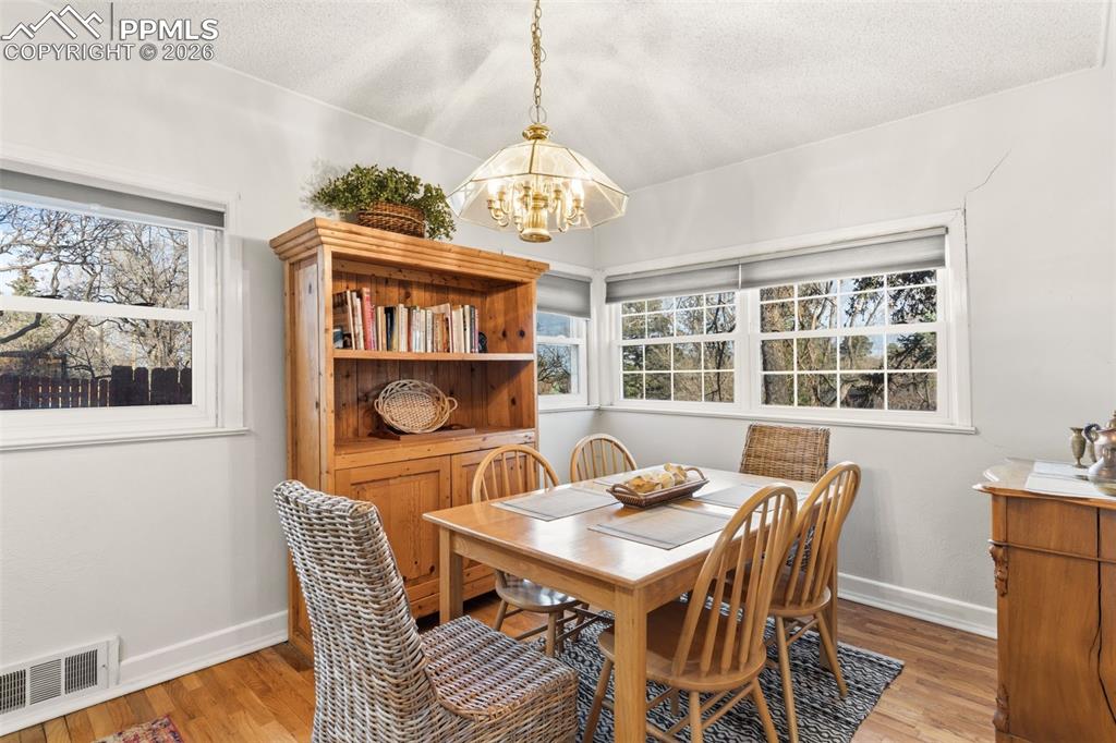 Image 18 of 50: A separate dining room area allows for space to host or simply enjoy for ev