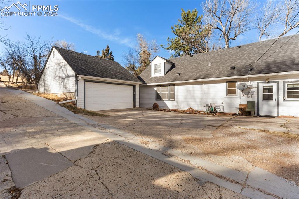 Image 8 of 50: The home features 2 separate detached garages - a 2-car and a 5-car!