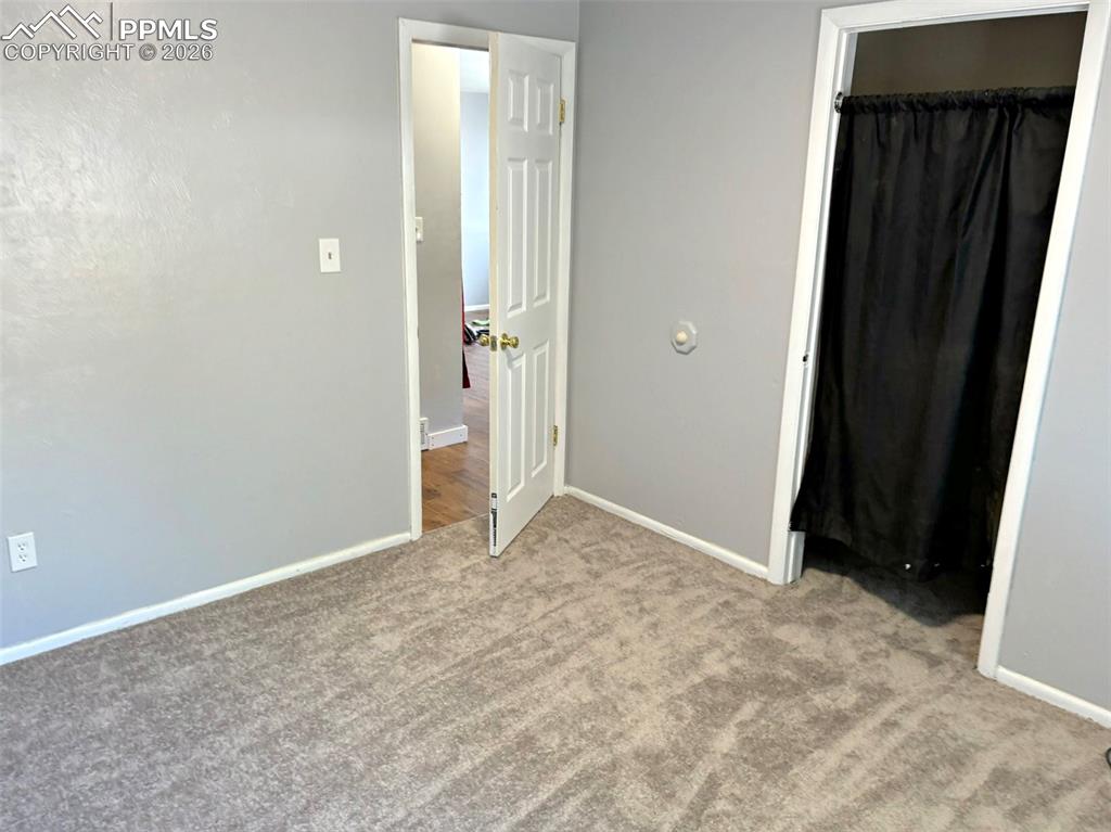 Image 3 of 17: Unfurnished bedroom featuring light colored carpet