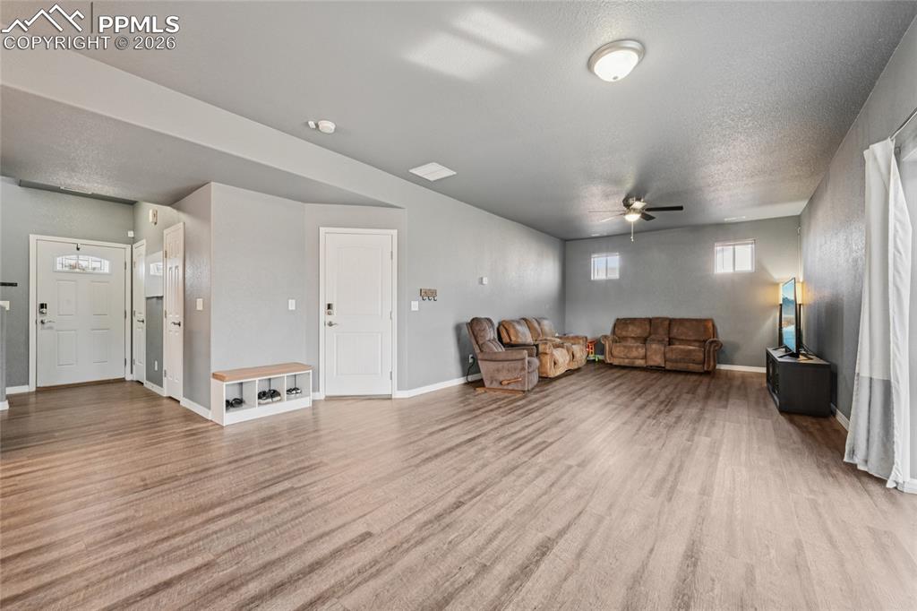 Image 10 of 42: Luxury vinyl floors provide a huge, open living space that can be organized