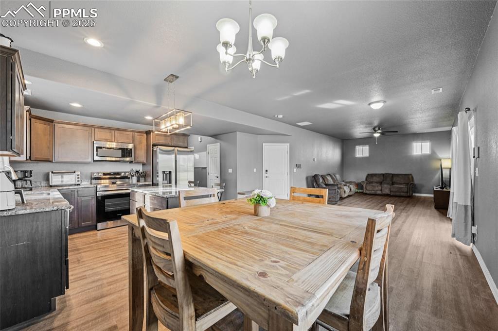 Image 14 of 42: Make dining area off kitchen or in front of sliding glass doors.