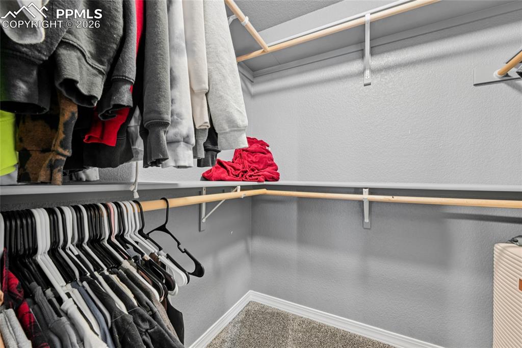 Image 29 of 42: Large master closet.