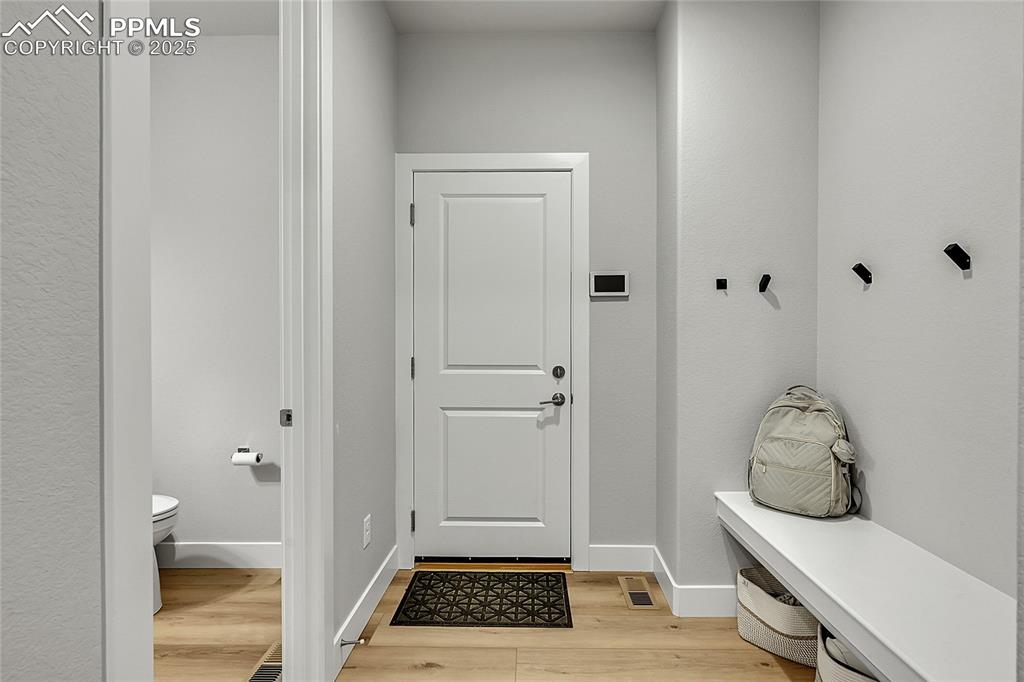 Image 14 of 44: Mudroom featuring light wood-type flooring and baseboards