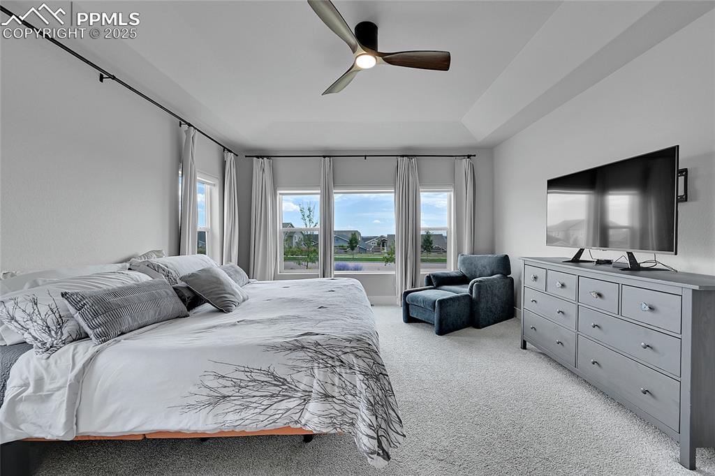 Image 18 of 44: Bedroom featuring light carpet and ceiling fan