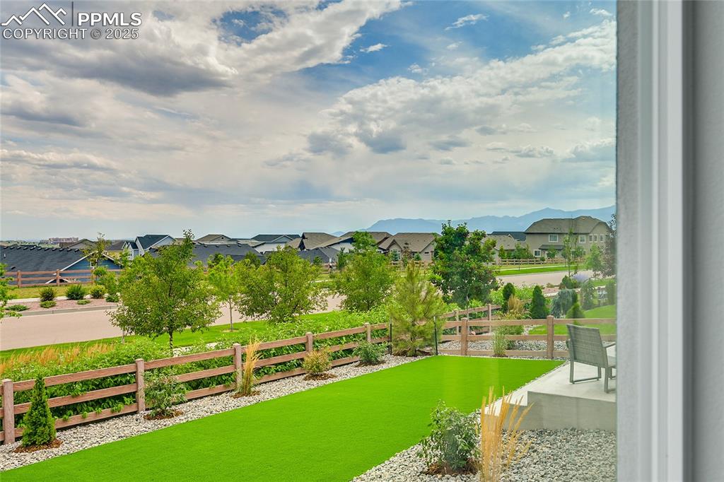 Image 22 of 44: View of yard with a residential view