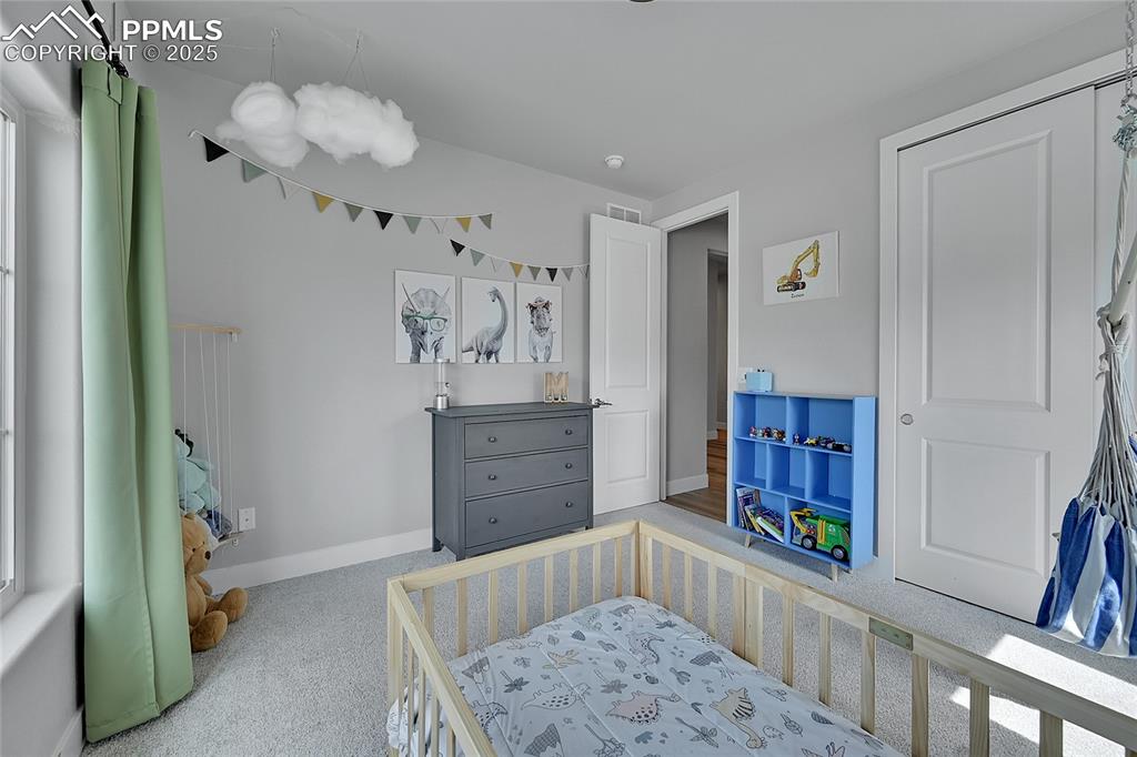 Image 26 of 44: Carpeted bedroom featuring baseboards