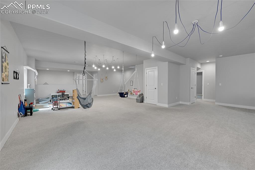 Image 27 of 44: Basement featuring carpet flooring and recessed lighting