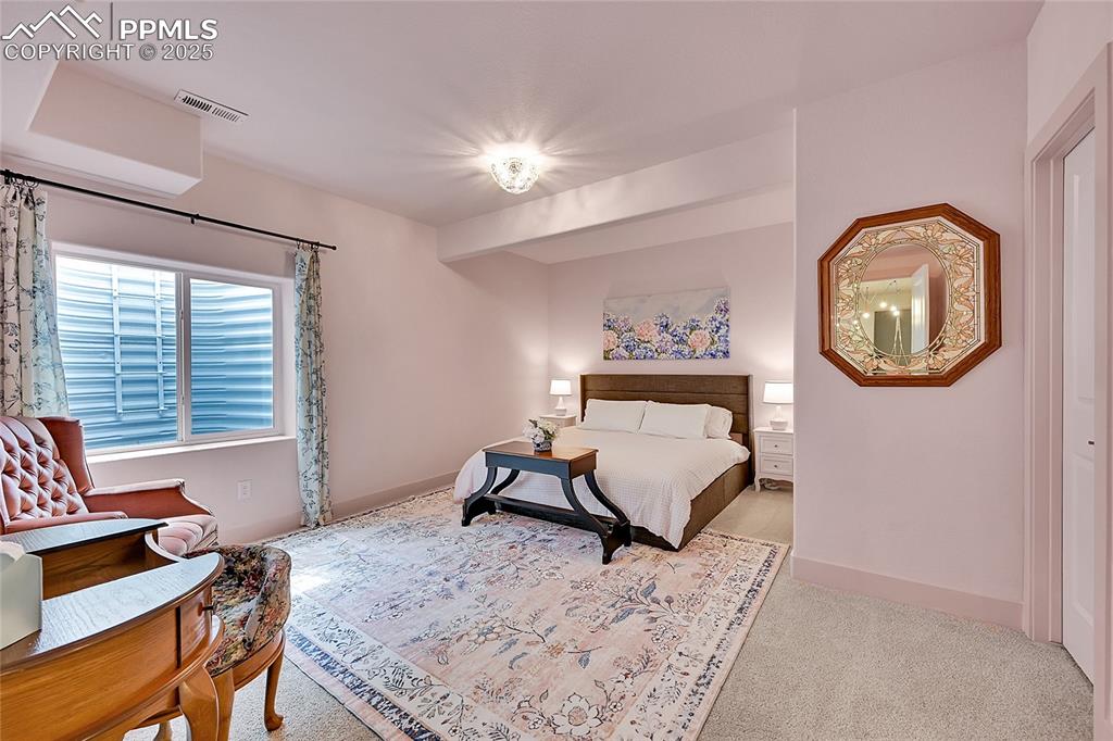 Image 29 of 44: Carpeted bedroom with baseboards