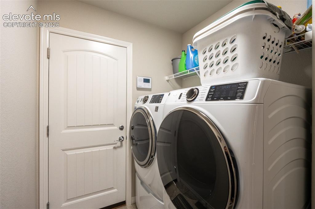 Image 24 of 42: Laundry room off garage - main floor
