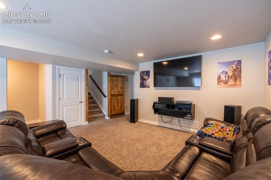 Image 26 of 42: Second living room - basement