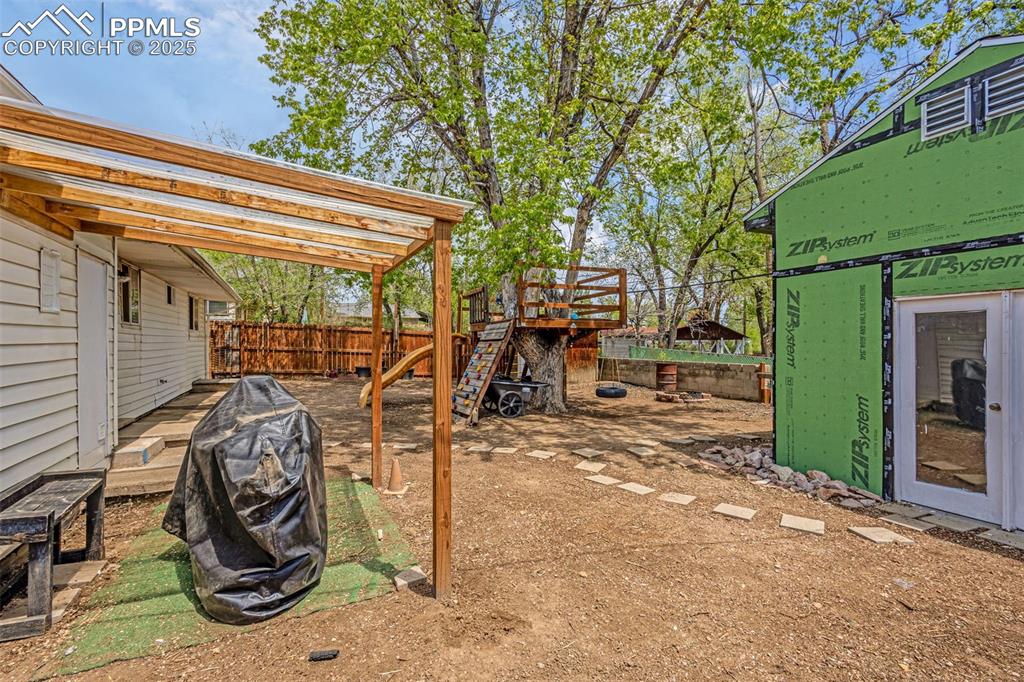 Image 16 of 30: View of yard featuring fence