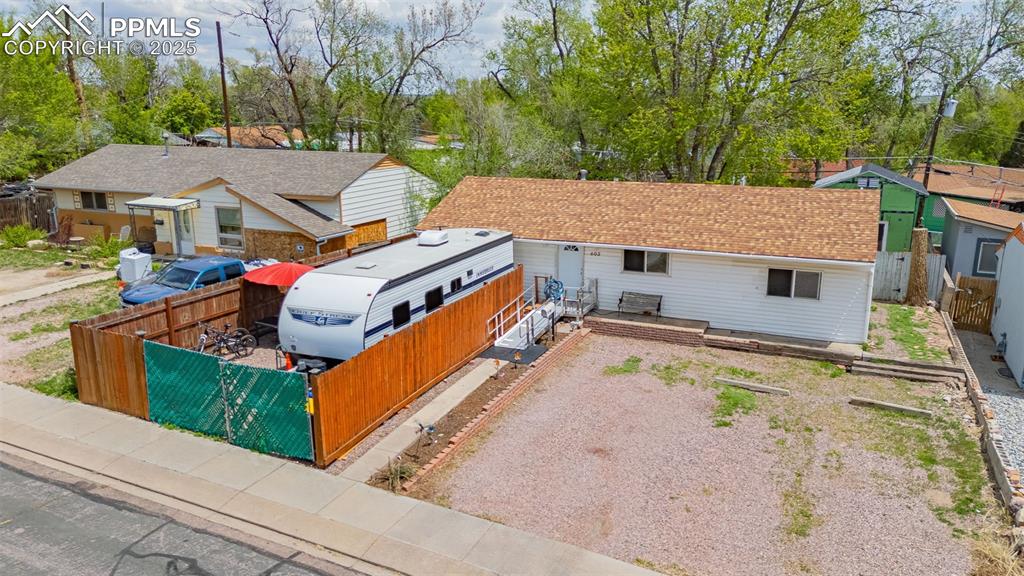 Image 27 of 30: View of front of property with gravel driveway