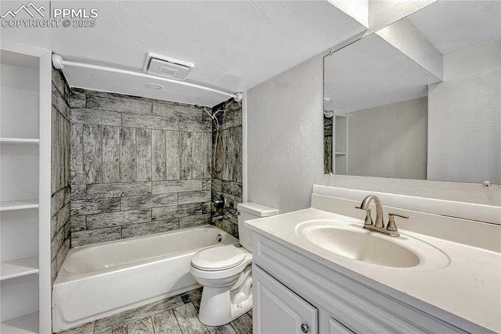 Image 15 of 29: Bathroom featuring  shower combination and vanity