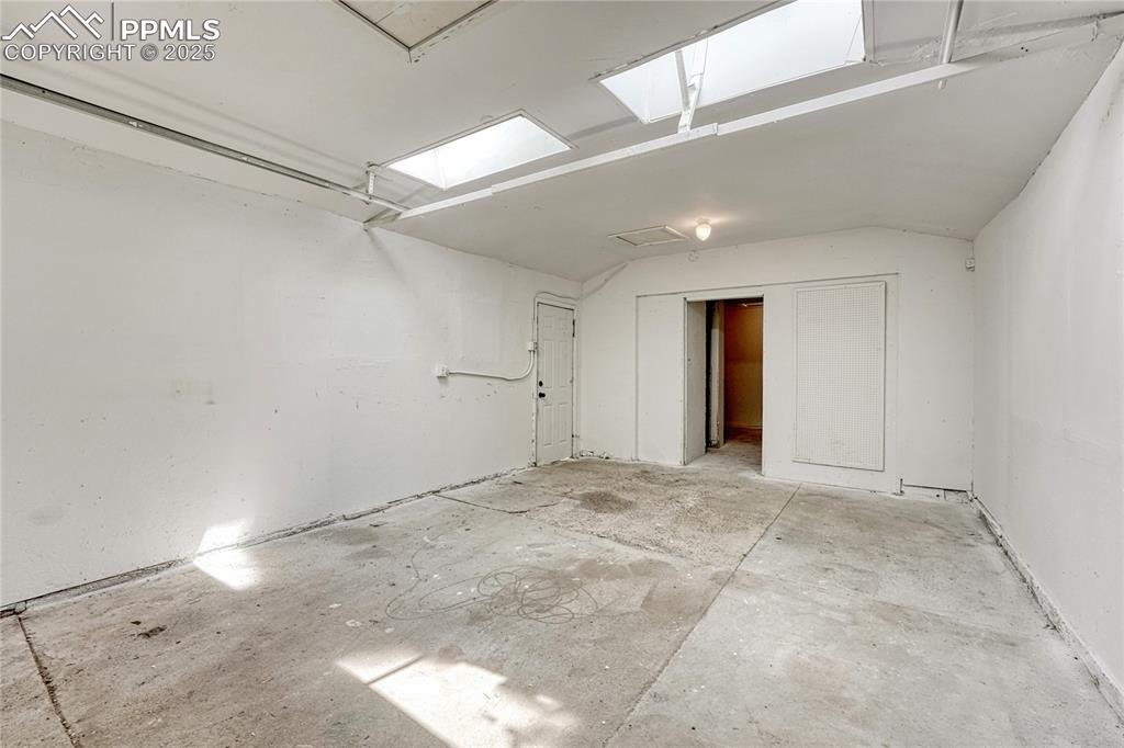 Image 20 of 29: Large and bright 1-car garage facing back.
