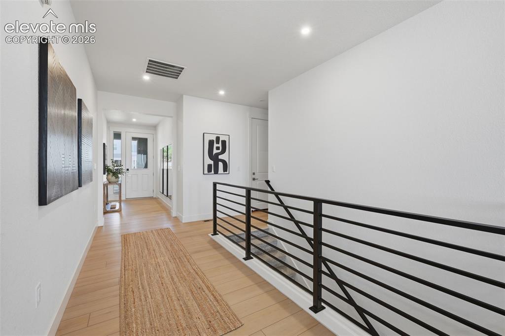 Image 16 of 44: entry with metal railing