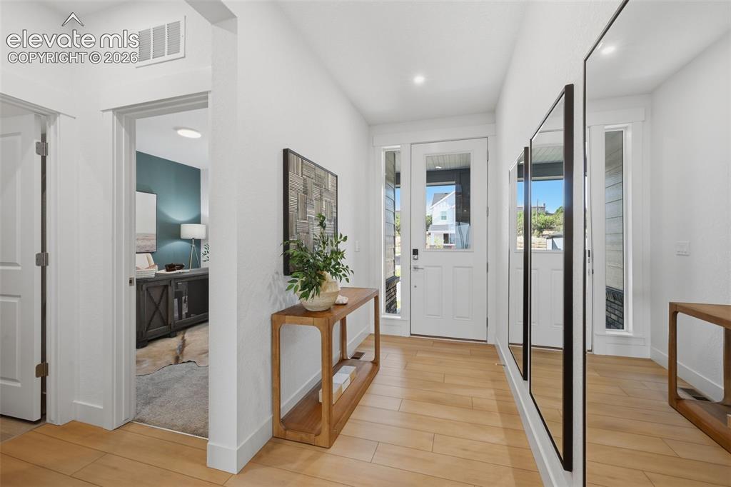 Image 4 of 49: Bright main level with 8 foot doors 