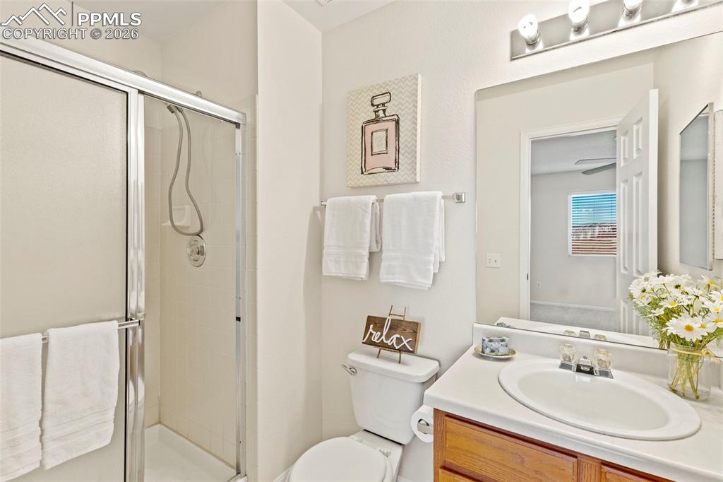 Image 14 of 26: Full bathroom with a stall shower and vanity