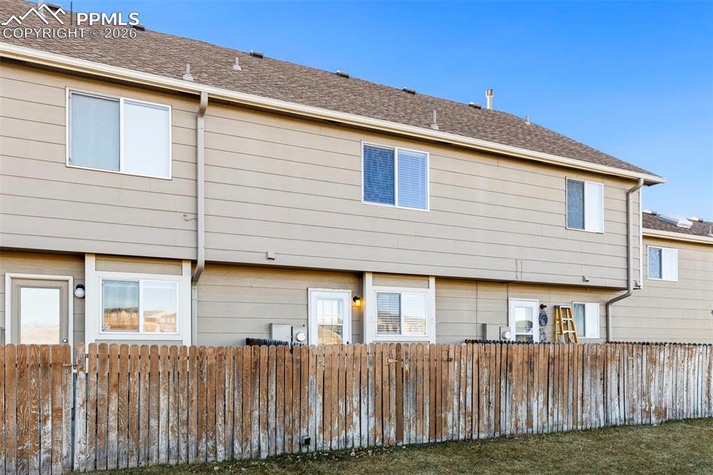 Image 25 of 26: Rear view of property with a shingled roof