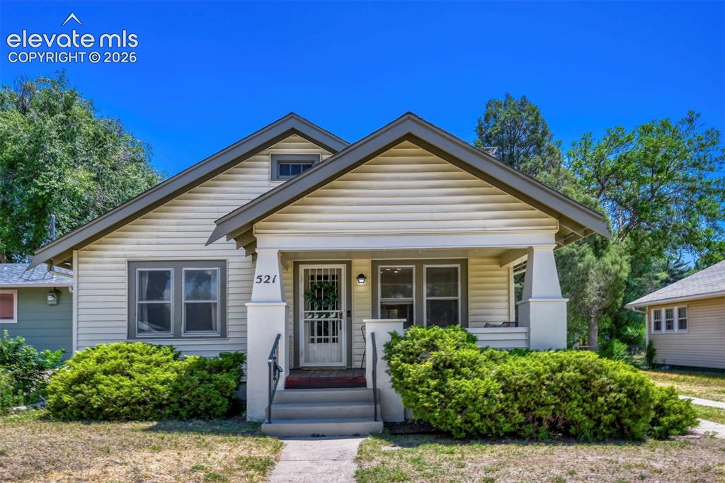 Image 1 of 36: Amazing curb appeal with covered front porch facing west!