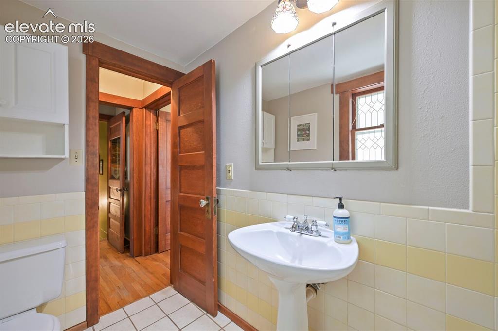 Image 14 of 36: View to bedroom from the spacious and bright primary bathroom!